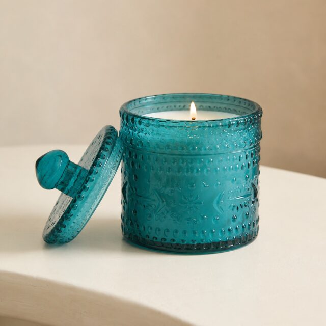 This is what the ocean would look like if it sat still long enough to become a candle jar.
Deep teal. Hobnail texture. A botanical embossed body that catches light the way water catches sunlight at noon. And a glass lid with a solid knob handle that closes with the kind of satisfying weight that tells a customer everything they need to know about quality before they have read a single word.
This vessel does not sit on a shelf. It anchors it.

Our Teal Hobnail Embossed Glass Candle Jar is one of those rare products that works harder than the brand behind it. It walks into a spa and feels at home. It sits in a boutique hotel room and looks like it was always there. It lands in a gift box and makes the recipient feel genuinely seen.
The colour alone is a commercial decision. Teal sits at the intersection of calm and confidence, the exact emotional register that today's premium home fragrance buyer is actively seeking.
Pair it with ocean mist, sea salt and driftwood, white tea and eucalyptus, or cool amber and aquatic musk and you have a product that does not just sell once.
It sells every season, every year, without apology.

Your summer range has one empty slot left. This fills it perfectly.

DM us or comment for catalogue.

#TealCandleJar #CoastalHomeDecor #WholesaleCandleSupplier #PrivateLabelCandles #GlobalCandleExporter