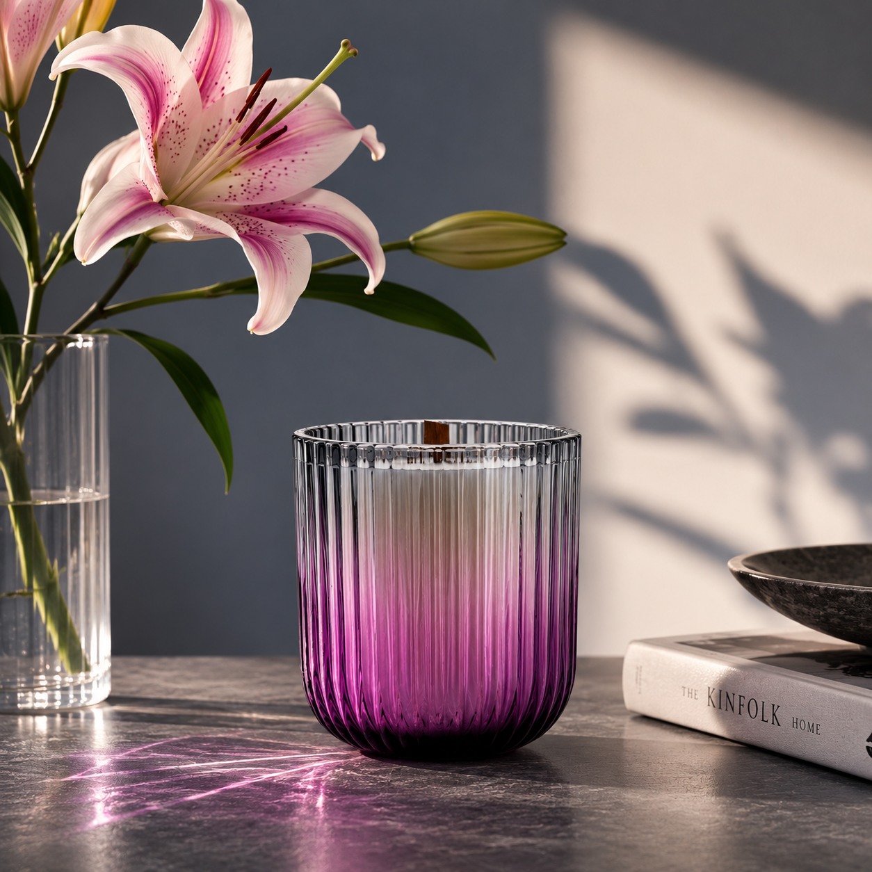 Deep amethyst at the base, crystal clear at the rim, and engineered to turn ambient light into a display feature

Color alters how a customer expects a fragrance to smell before they ever light the wick. A deep plum-purple tint at the weighted base fades smoothly into transparent glass at the rim, anchoring the vessel visually while keeping the upper wax line completely clear. The vertical fluted ribs don't just offer tactile grip
they catch ambient sunlight and project vibrant, violet light pools across studio backdrops and retail displays.

That optical refraction makes a massive difference for e-commerce photography, giving your product listings immediate depth and visual interest without needing elaborate props. Crafted with thick-walled glass for thermal stability and a balanced hand-feel, the clean silhouette accommodates wooden wicks and multi-wick setups seamlessly. It brings a subtle, dramatic flair to autumn releases, moody floral ranges, or boutique luxury drops.

At Alchemy Art Studio, we manufacture and export glass packaging engineered specifically for private-label candle brands, international retailers, and global fragrance houses. From bespoke ombré gradients and precise Pantone color matching to custom fluted molds, our Indian manufacturing facility delivers the finish, consistency, and export-grade quality your brand needs to stay distinctive.

If you were adding this purple ombré vessel to your upcoming collection, would you pair it with a rich, woody resin scent or a moody, dark floral profile? Let us know in the comments.

#CandlePackaging #CandleVessels #GlasswareManufacturer #HomeFragrancePackaging #PrivateLabelCandles #CandleDesign #ProductPackaging #WholesaleGlassware #ExportQuality #AlchemyArtStudio