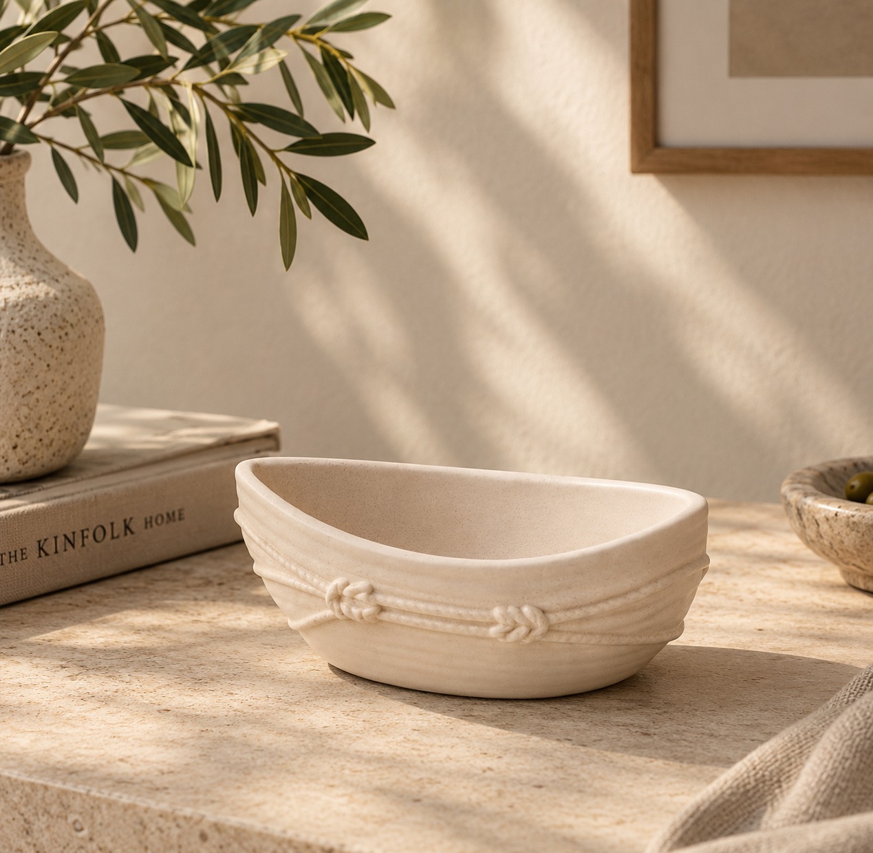 Inspired by the beauty of handcrafted details. ✨ 

With its soft ivory tone, organic silhouette and delicate rope-inspired embellishments, this ceramic bowl brings a distinctive artisanal touch to everyday interiors. The subtle texture and sculptural detailing make it a versatile accent for coffee tables, console styling, curated shelves and thoughtfully designed home décor collections. Its understated palette blends effortlessly with contemporary, rustic and Mediterranean-inspired spaces, proving that even the smallest details can give a product its own character.

At Alchemy Art Studio, we manufacture and export ceramic, glass, metal and other home décor products for international brands, retailers and private-label businesses. We believe quality lies in the details—from material selection and surface finishing to decorative precision and consistency across production. Our custom manufacturing capabilities allow buyers to explore distinctive shapes, colours, textures and finishes that complement their brand identity. Whether you are developing a collection of decorative bowls, candle vessels, tabletop accents or functional home accessories, we help transform creative concepts into refined products designed for the global market.

#AlchemyArtStudio #CeramicHomeDecor #DecorativeBowl #HomeDecorDesign #CustomManufacturing #PrivateLabel #B2BHomeDecor #InteriorStyling #CeramicDecor #GlobalSourcing